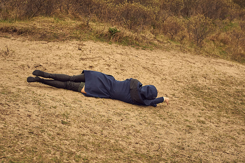 Rolling around in the blue Aqua Raincoat byBrown